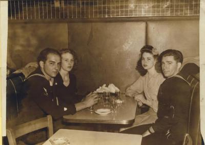 Frank, fellow officer, and their dates at Liberty in Brooklyn